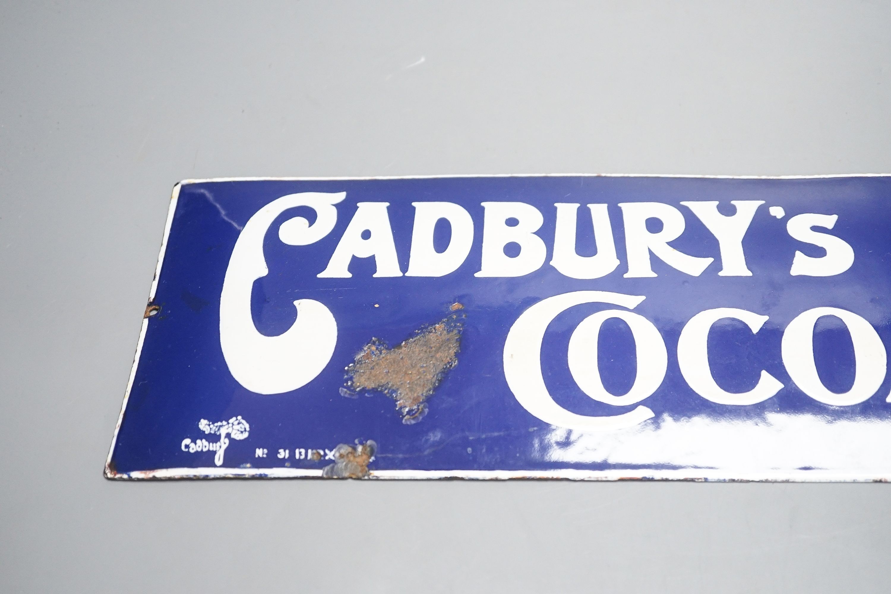 A Cadburys cocoa advertising enamel sign 15x35cm